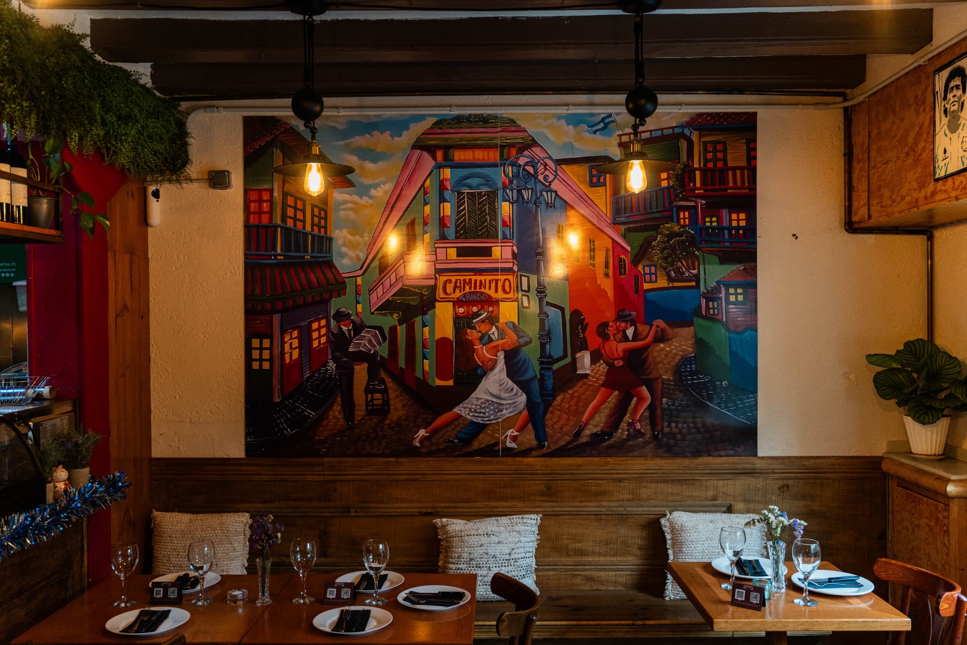 Wooden dining room beneath the colourful Caminito tango mural
